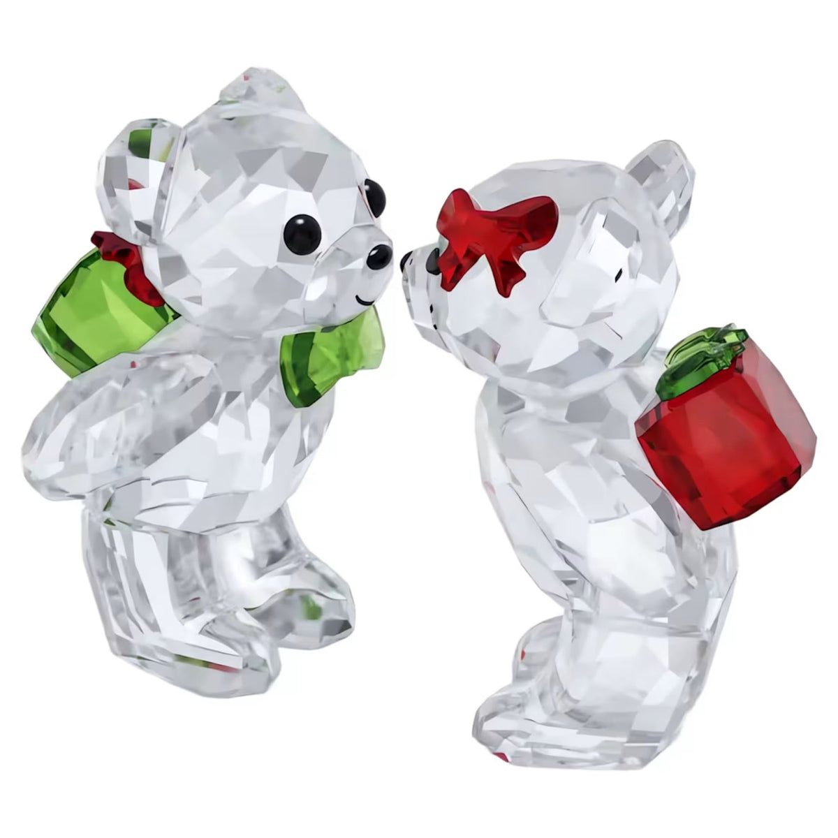 Swarovski Kris Bear -kristallifiguuri, kaksi kirkasta kristallinallea juhlavilla punaisilla ja vihreillä yksityiskohdilla juhlatunnelmassa
